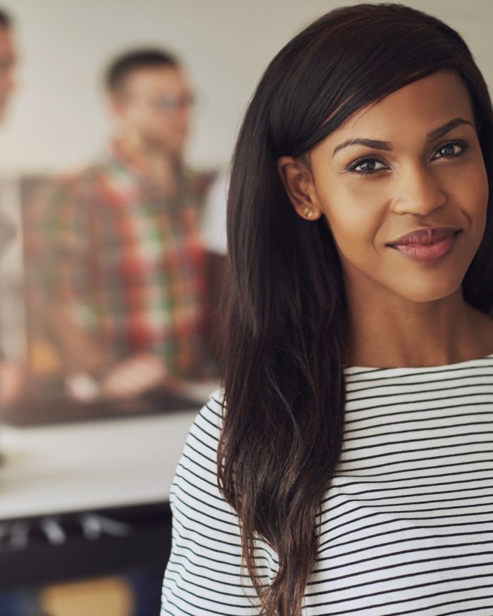 Grinning beautiful female business owner